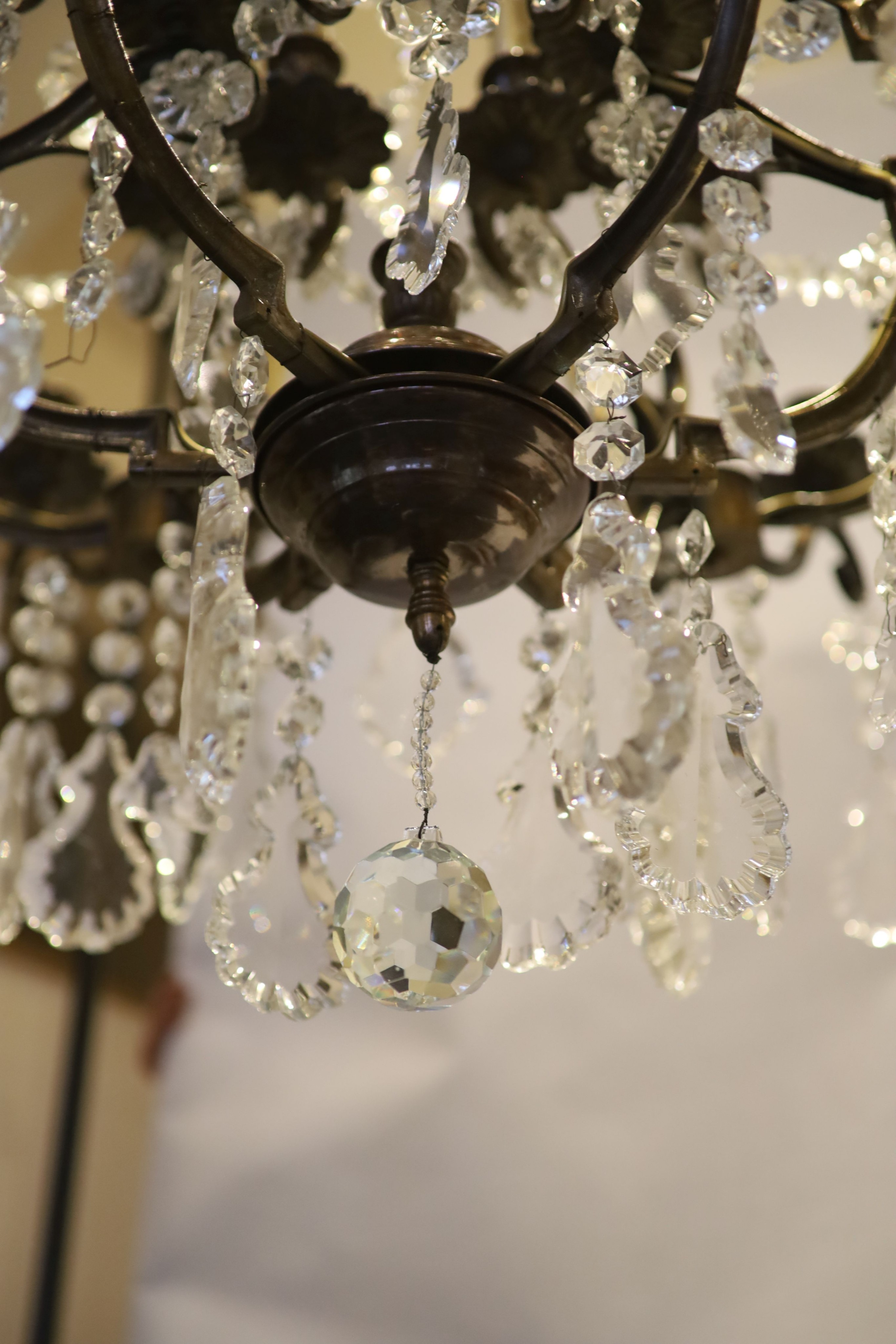 An 18th century style bronzed metal, cut glass 30 light chandelier by Christopher Wray, approximately 123 cm high